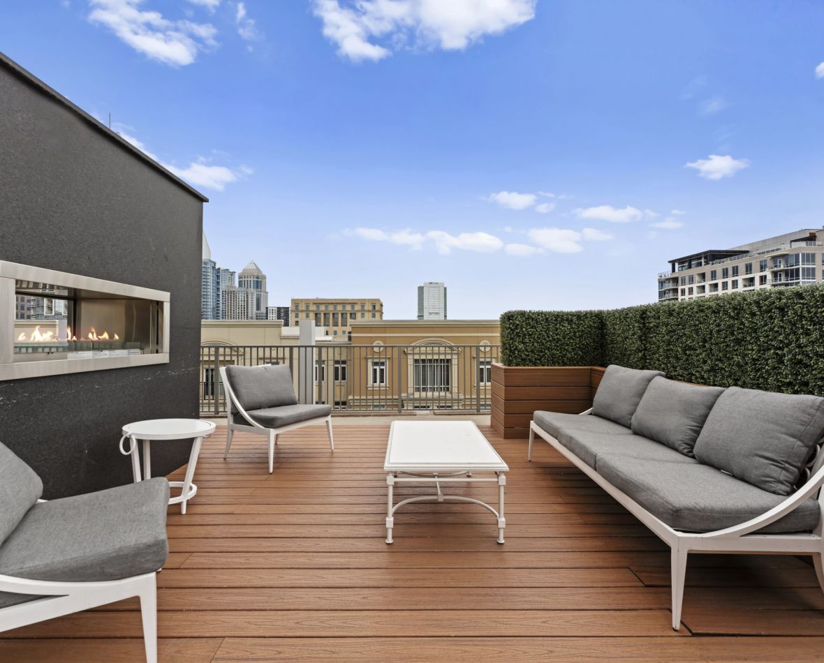 The Vue Charlotte outdoor lounge amenity area with couch, table, and chairs