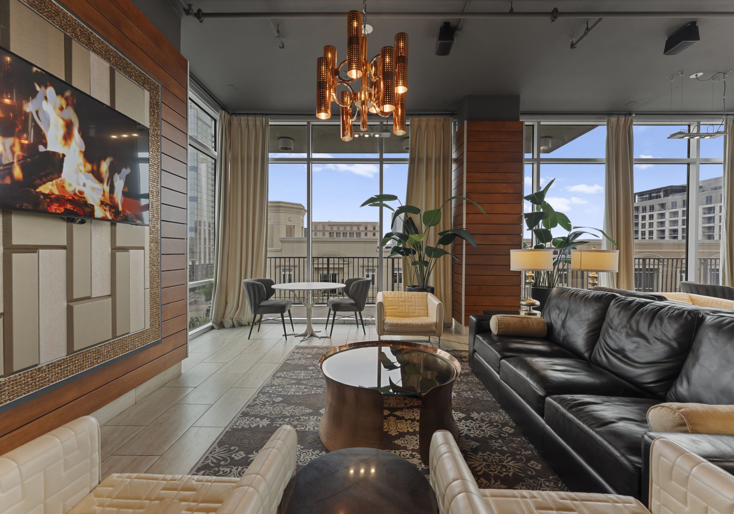 The Vue Charlotte business center and cyber cafe with work stations and floor to ceiling windows looking out over the city