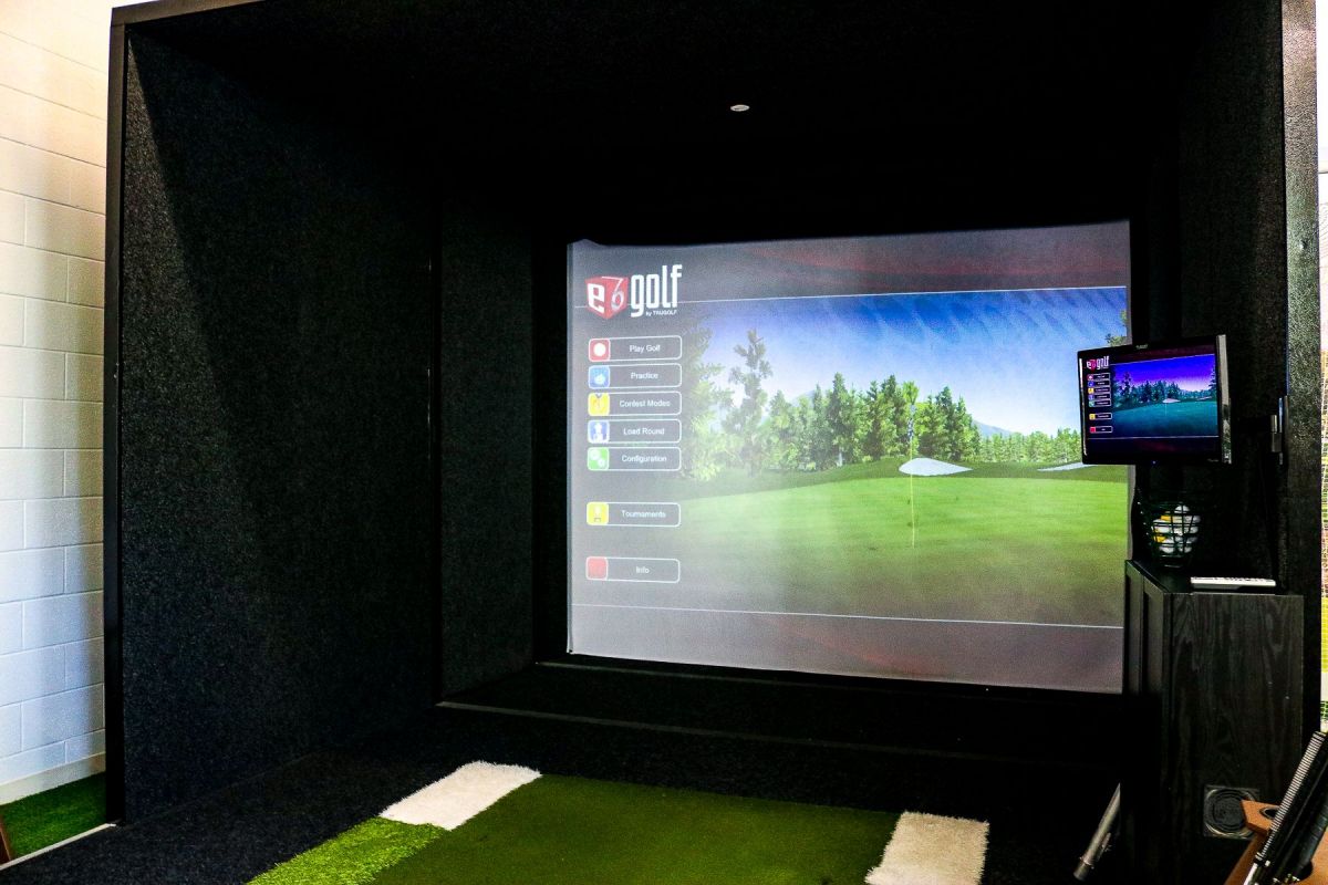 The Vue Charlotte golf lounge with simulator