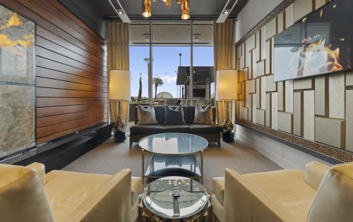 The Vue at Charlotte apartment interior with a view of the pool through floor to ceiling windows