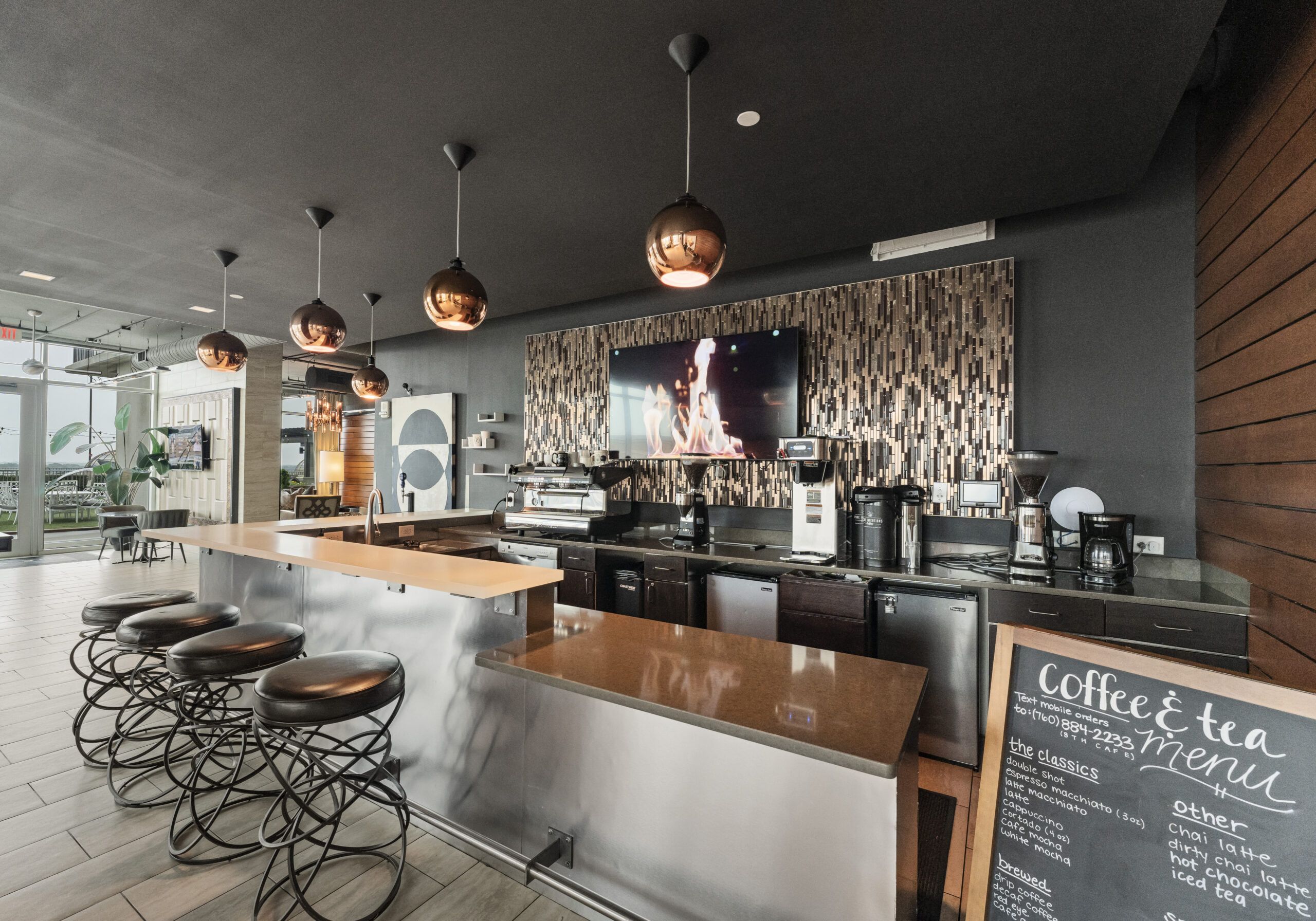 The Vue Charlotte resident coffee bar with granite countertops and stools