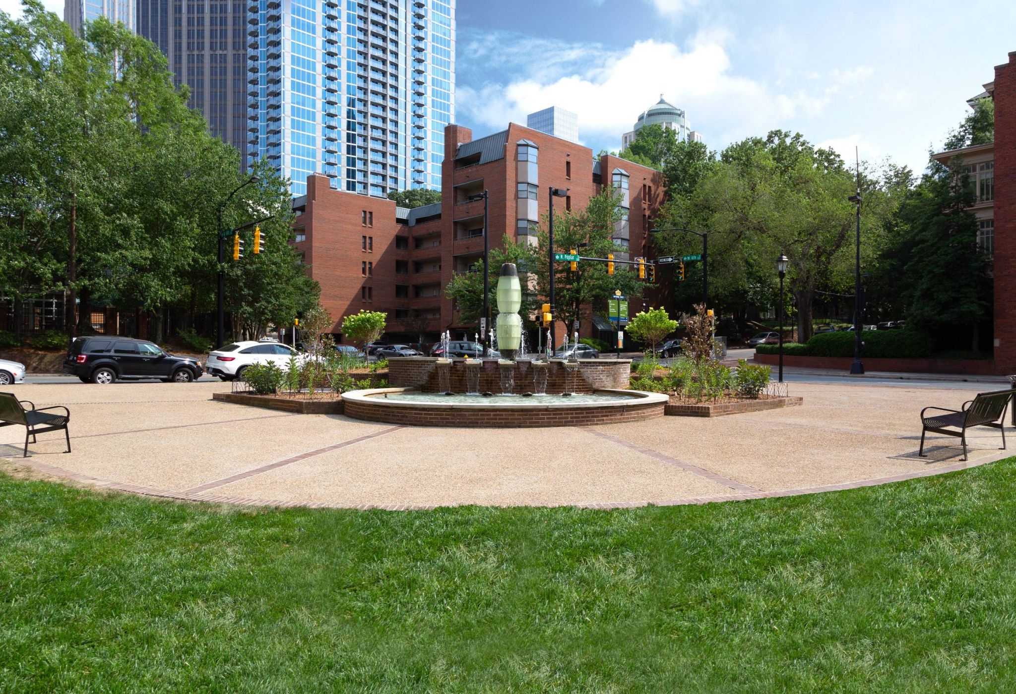 Grassy and green park with fountain near The Vue apartments in Charlotte, NC