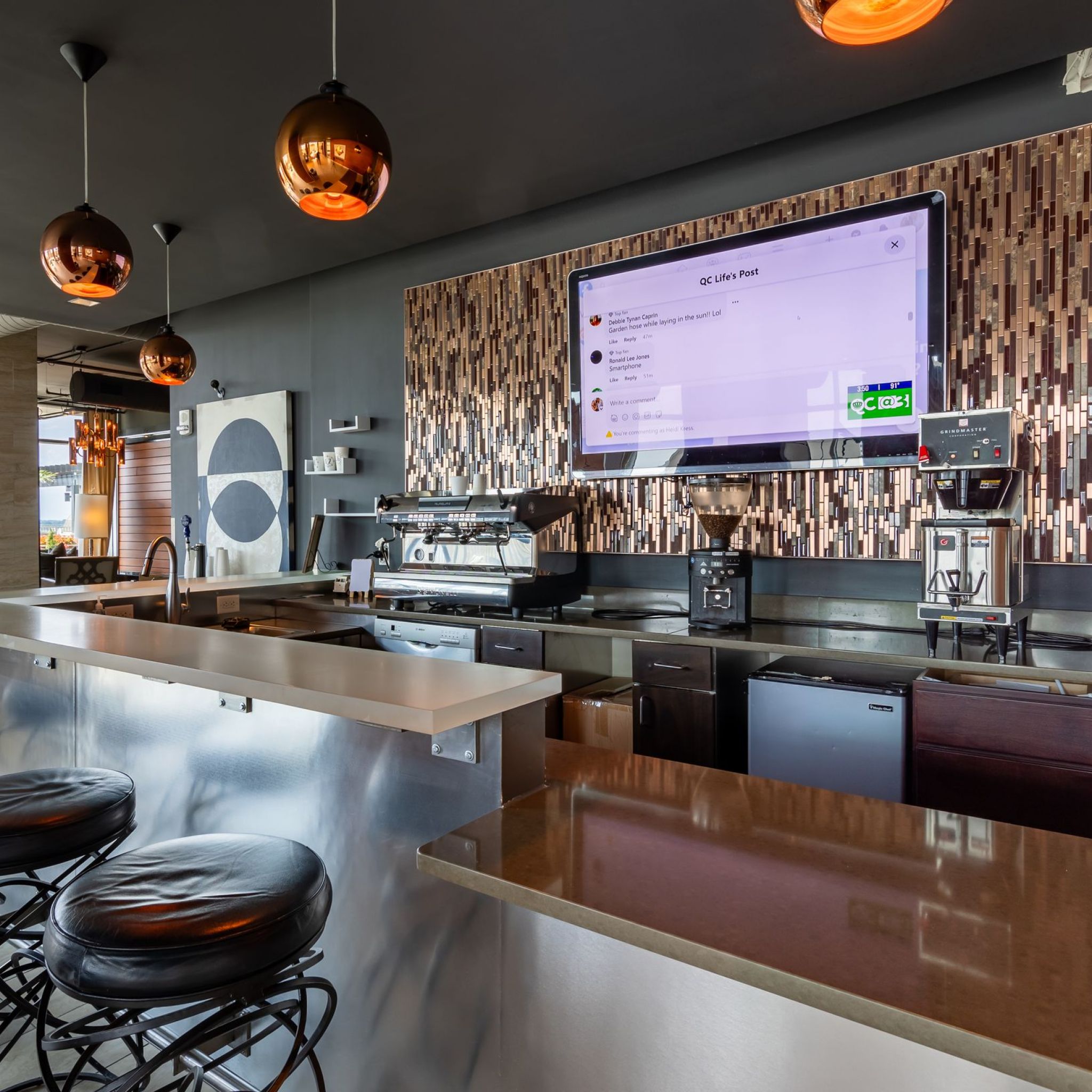 The Vue Charlotte resident coffee bar with granite countertops and stools