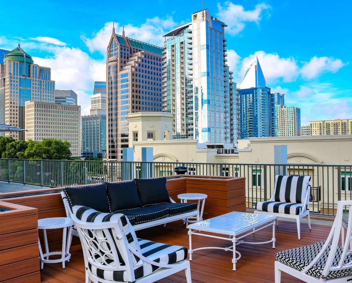 The Vue Charlotte outdoor lounge amenity area with couch, table, and chairs