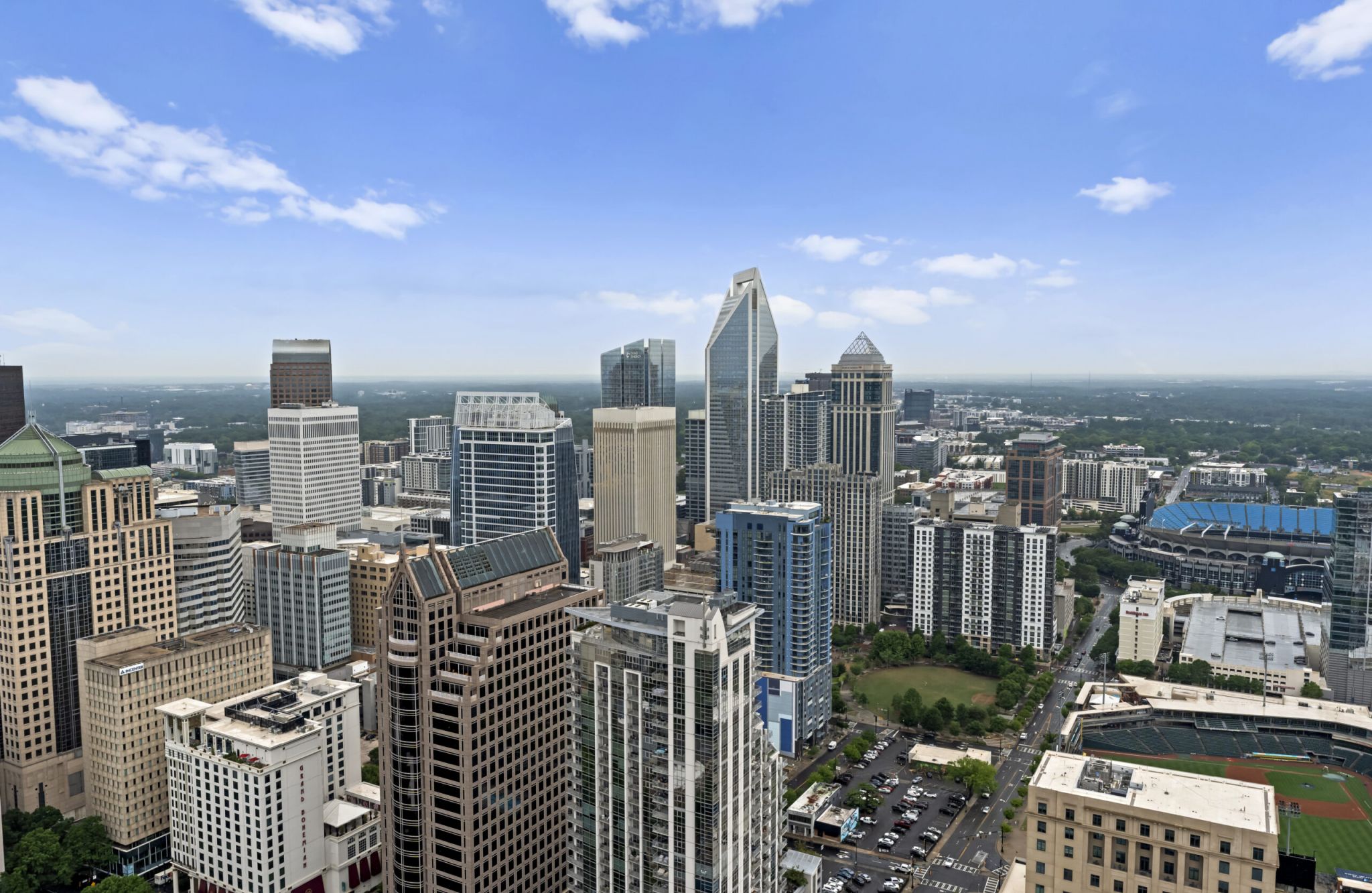 The Vue Charlotte apartment interior with 12'6" ceilings and floor-to-ceiling windows overlooking city