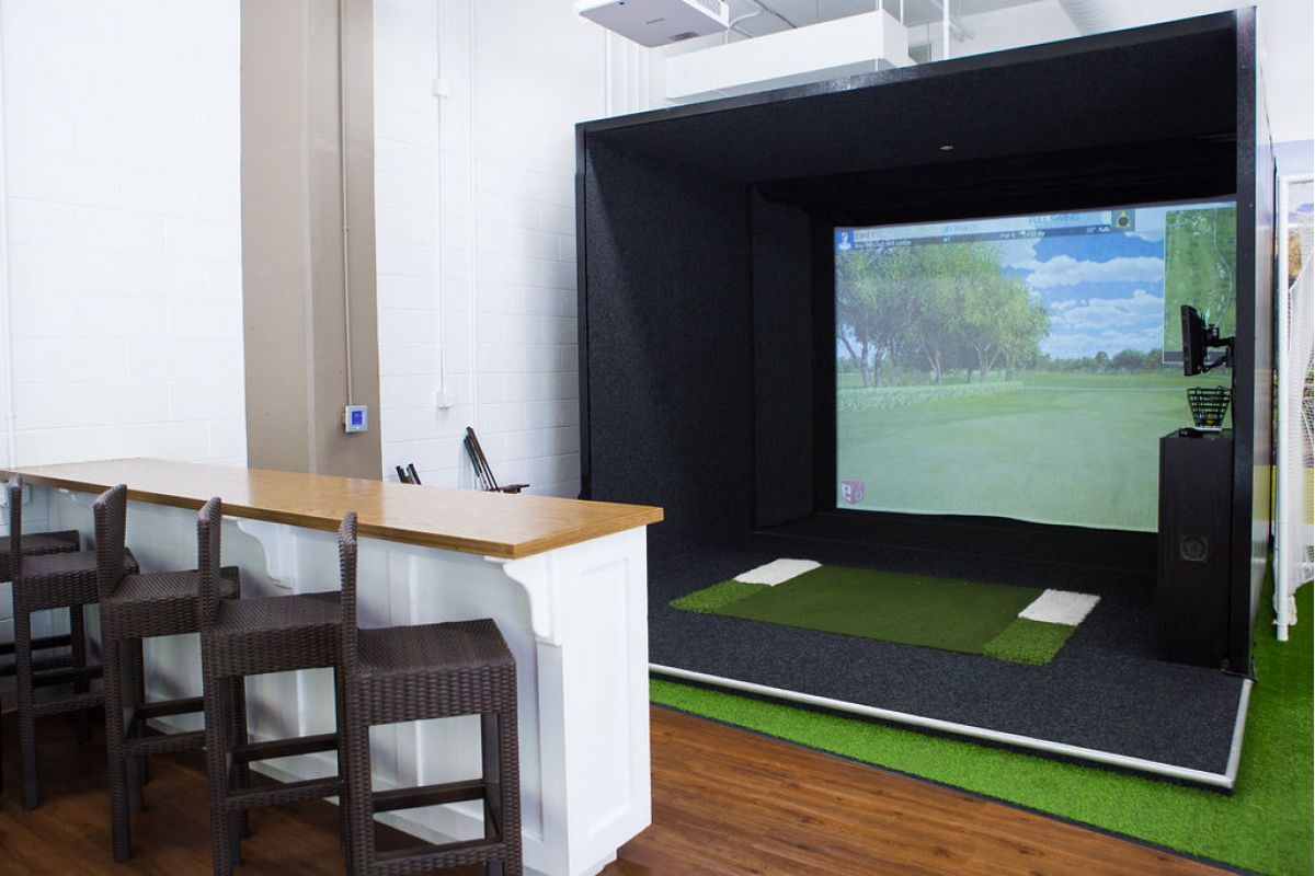 The Vue Charlotte golf lounge with simulator