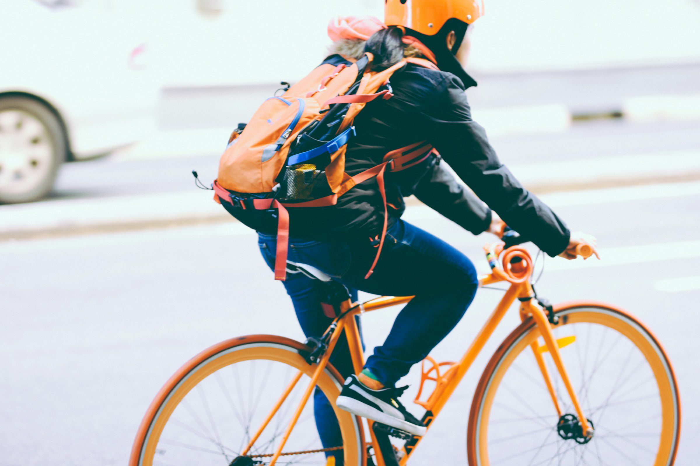 The Vue at Charlotte, NC - bikeriding in the neighborhood on an orange bike with an orange helmet