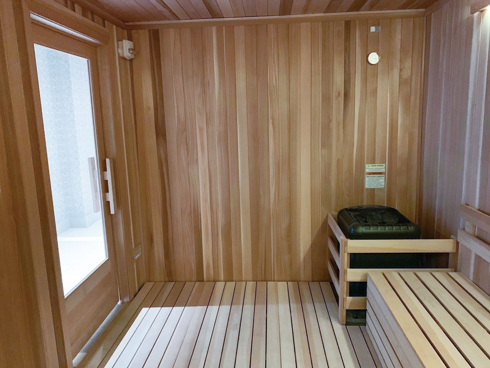 The Vue Charlotte sauna room in spa with wood paneling