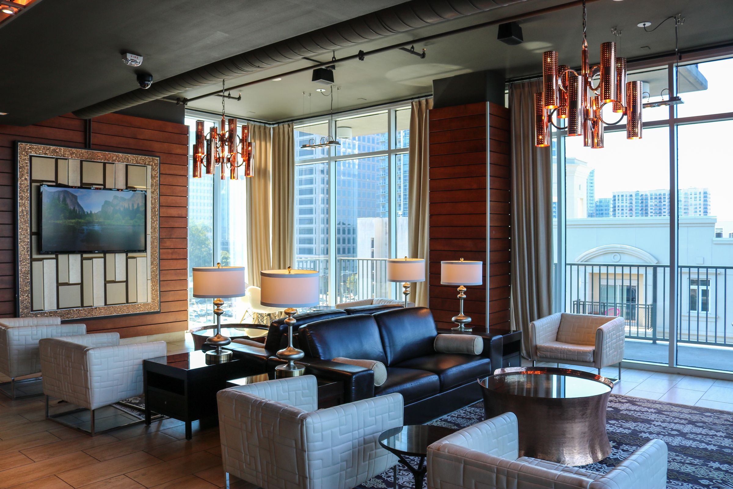 The Vue Charlotte apartment lounge area with couches and coffee tables and luxury finishes